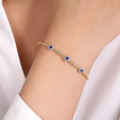 Best Gabriel & Co. 14K White-Yellow Gold Bujukan Sapphire and Diamond Halo Bangle